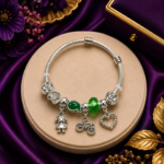 Ratnikaa Silver Charm Bracelet for Women & Girls | Adjustable Charm Bangle with Emerald Green Crystal, Girl, Bicycle & Heart Charms | Elegant Gift Bracelet for Birthday, Friendship & Special Occasions